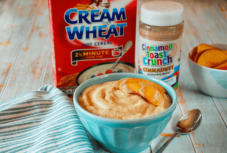 A bowl of Cinnadust™ Cream of Wheat in front of both the ingredient packages.