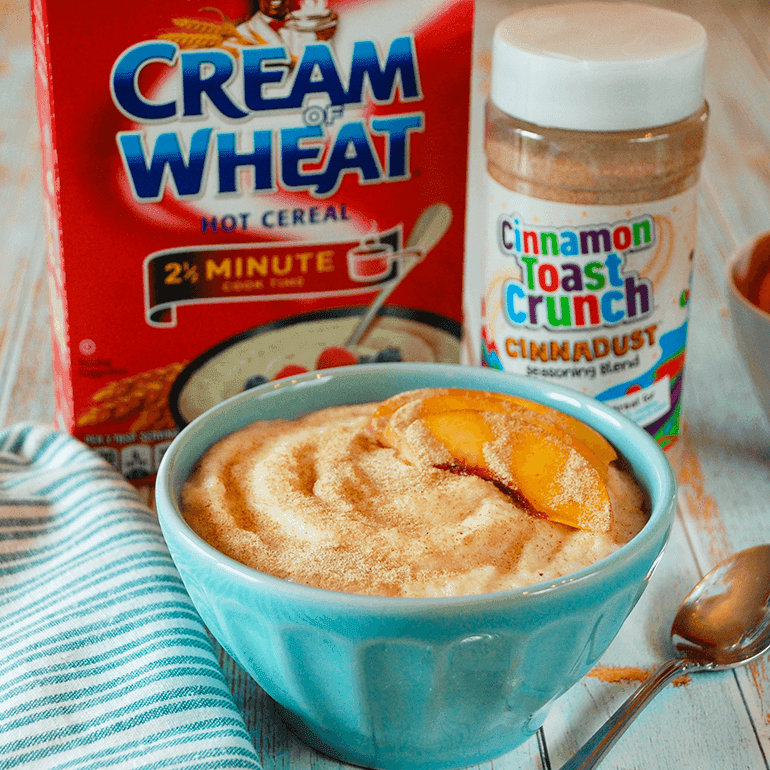 A bowl of Cinnadust™ Cream of Wheat in front of both the ingredient packages.