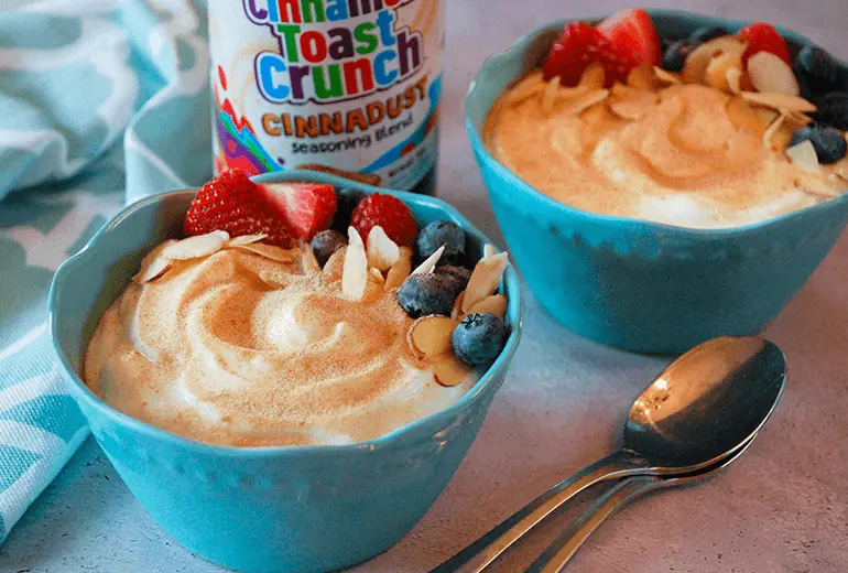 2 Cinnadust™ Fruit, Nut & Yogurt Bowls with a jar of Cinnadust™ between them.
